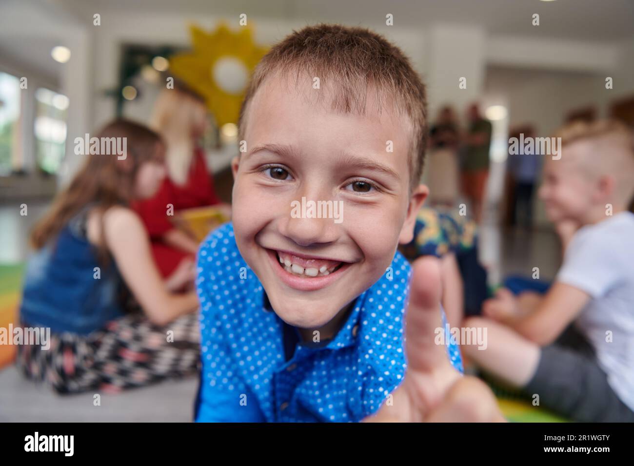 Portrait photo of a smiling boy in a preschool institution having fun ...