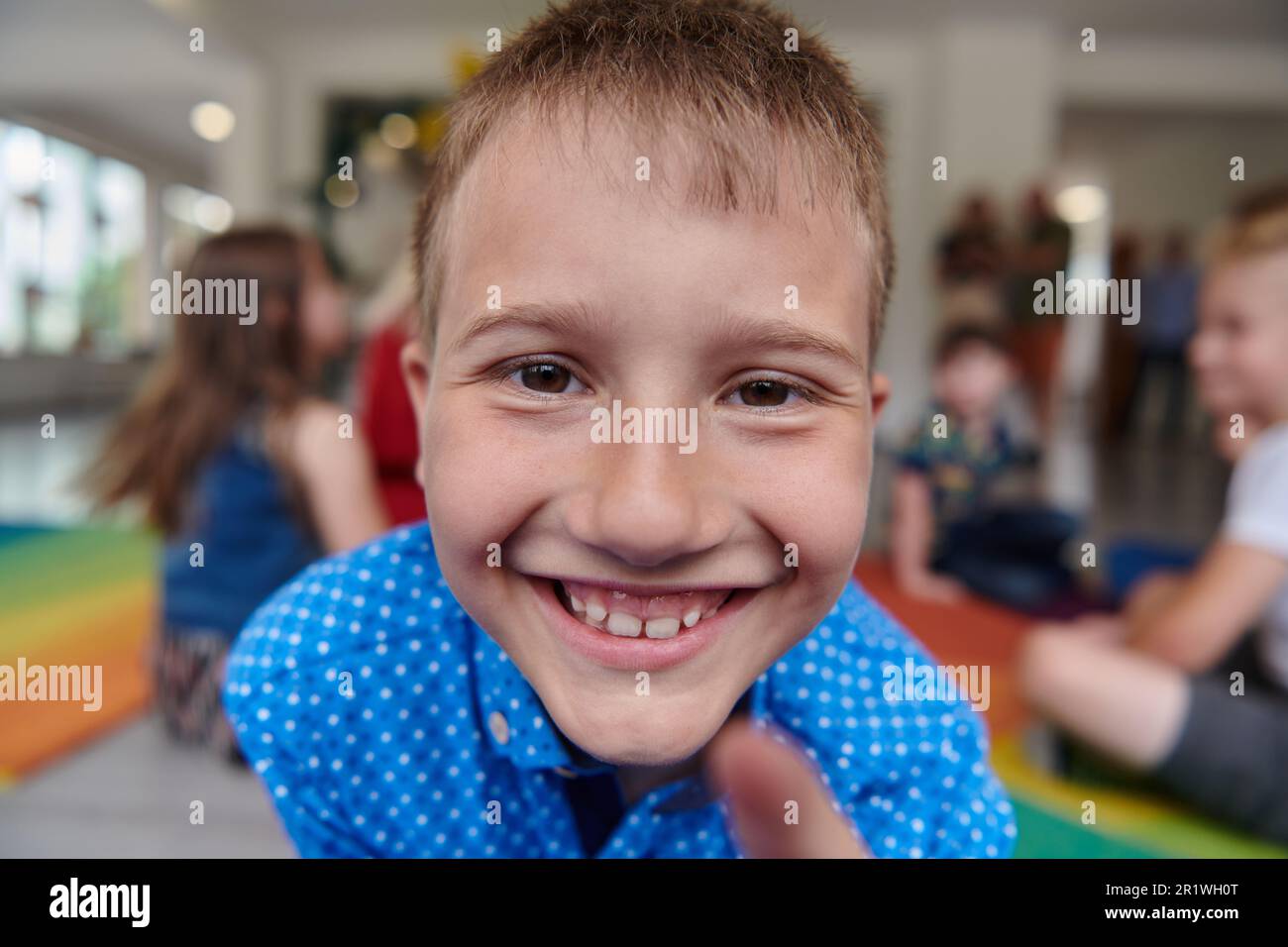 Portrait photo of a smiling boy in a preschool institution having fun ...