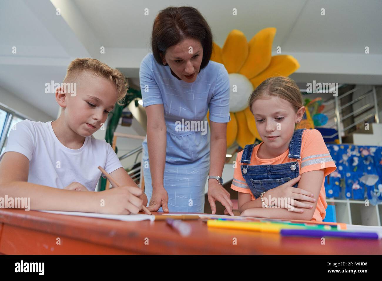 Creative kids during an art class in a daycare center or elementary ...