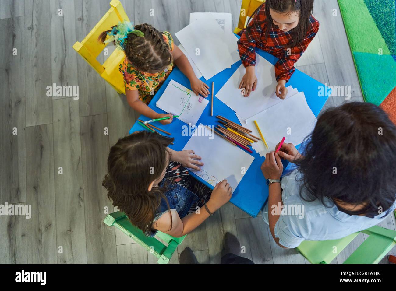Creative kids during an art class in a daycare center or elementary ...