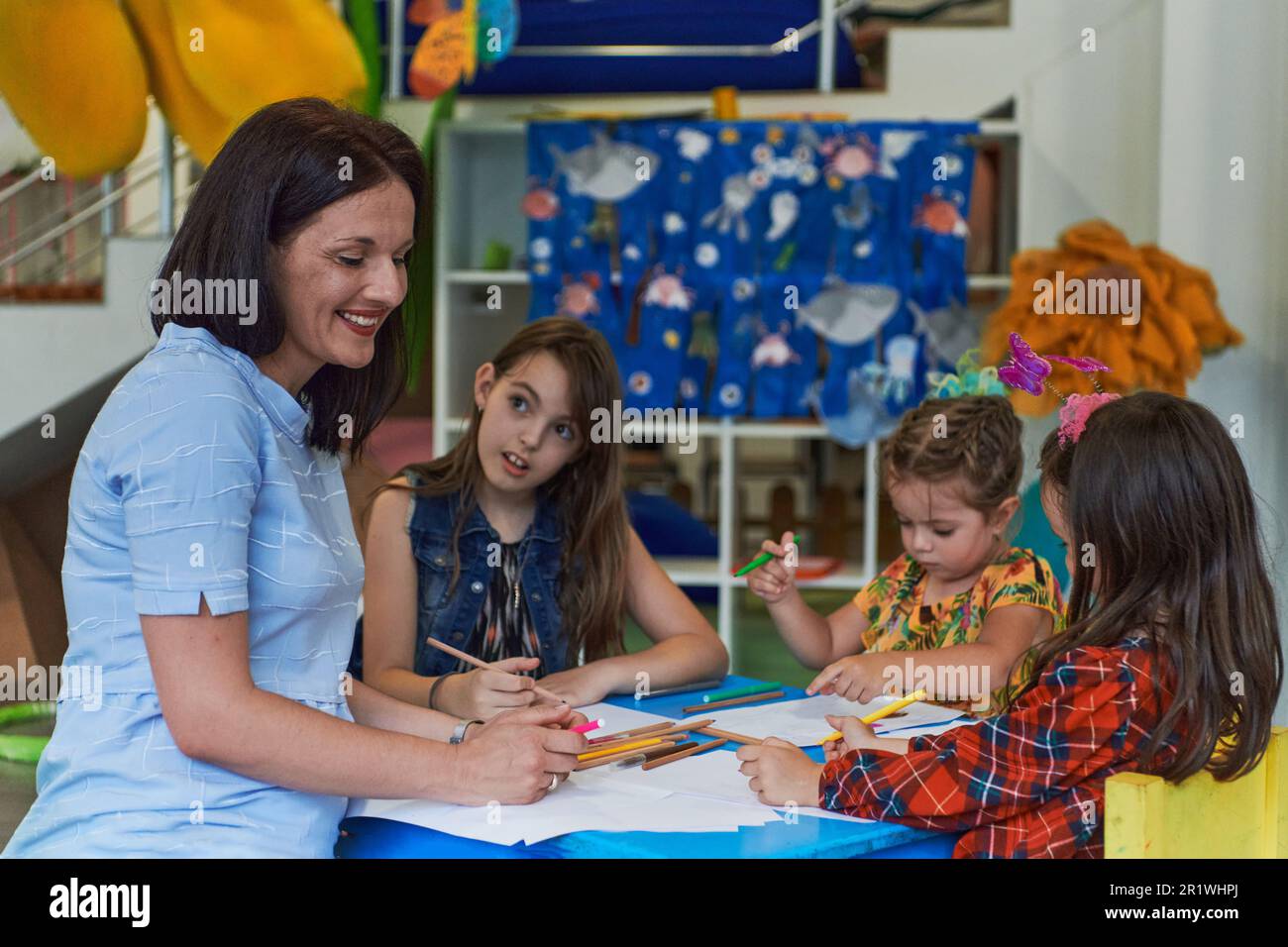 Creative kids during an art class in a daycare center or elementary ...