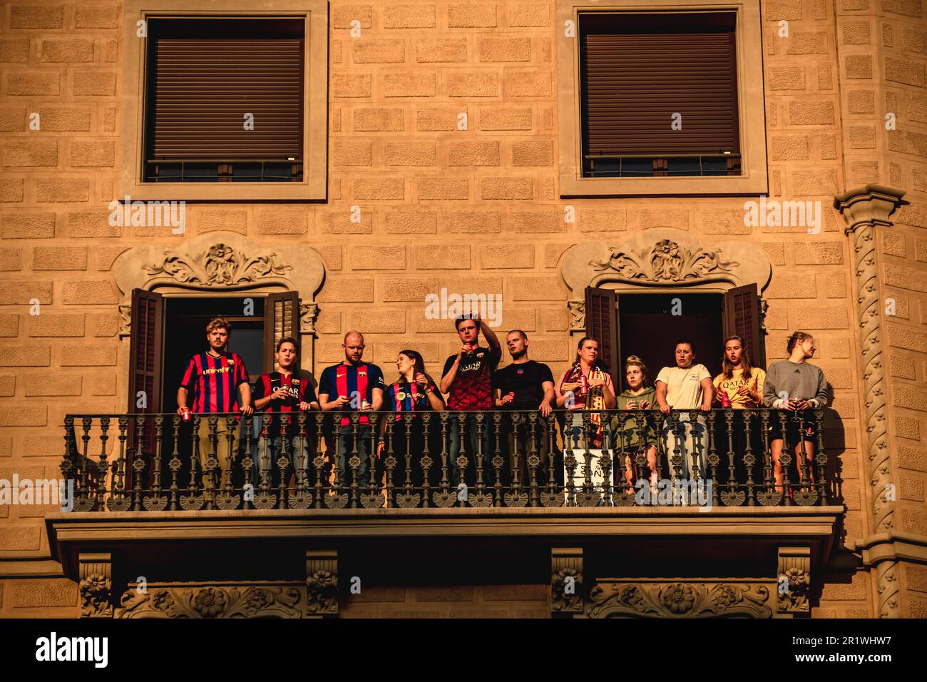 Barcelona, Spain. 15th May, 2023. Supporters gather to their windows and balconies to see the FC Barcelona's open top bus victory parade after the male and female team win the Spanish football league. Credit: Matthias Oesterle/Alamy Live News Stock Photo