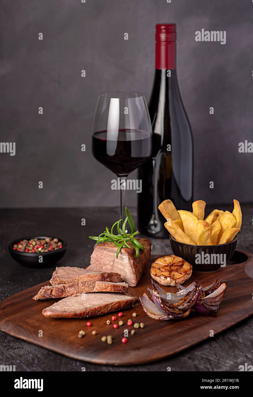 Food photography of roasted beef, joint, fillet, fries, chips, onion, rosemary, garlic, pepper