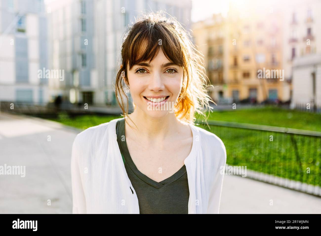 Outdoors portrait of beautiful young girl smile at camera Stock Photo ...