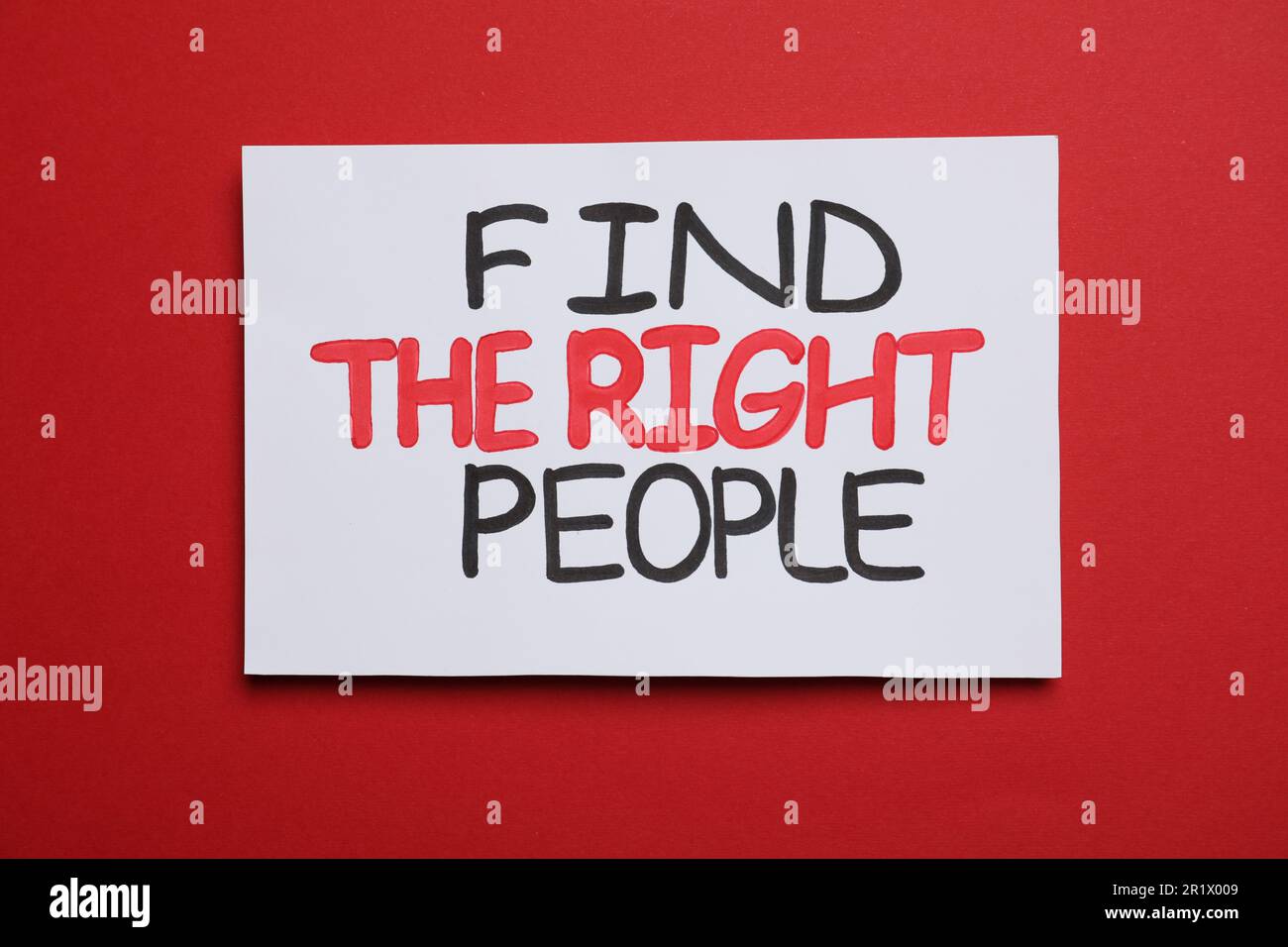 Card with motivational phrase Find The Right People on red background Stock Photo