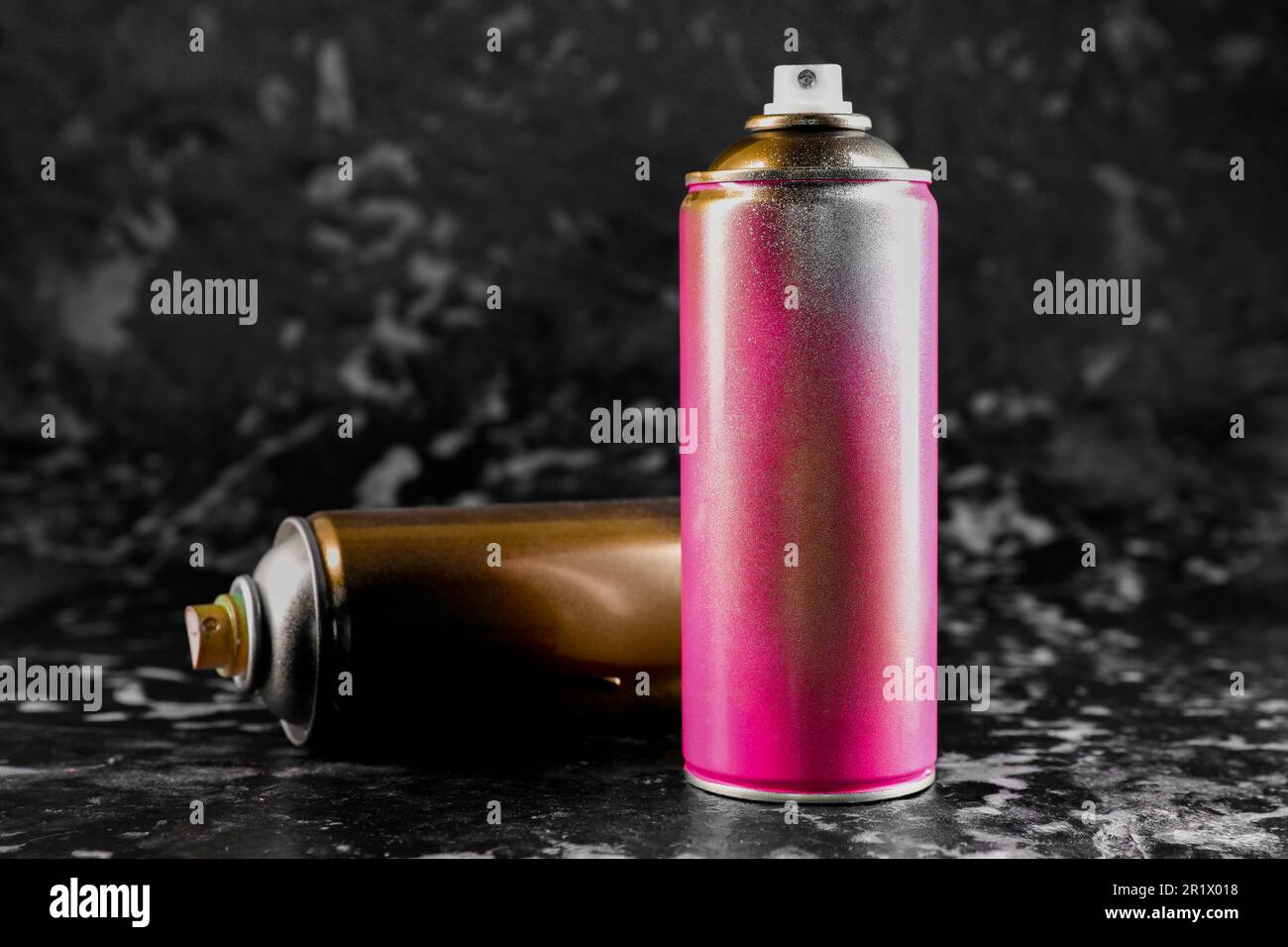 Used cans of spray paint on black marble background Stock Photo Alamy
