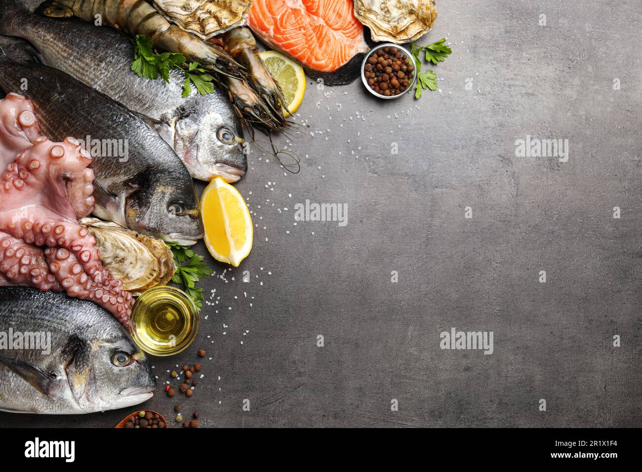Flat lay composition with fresh raw dorado fish and different seafood ...