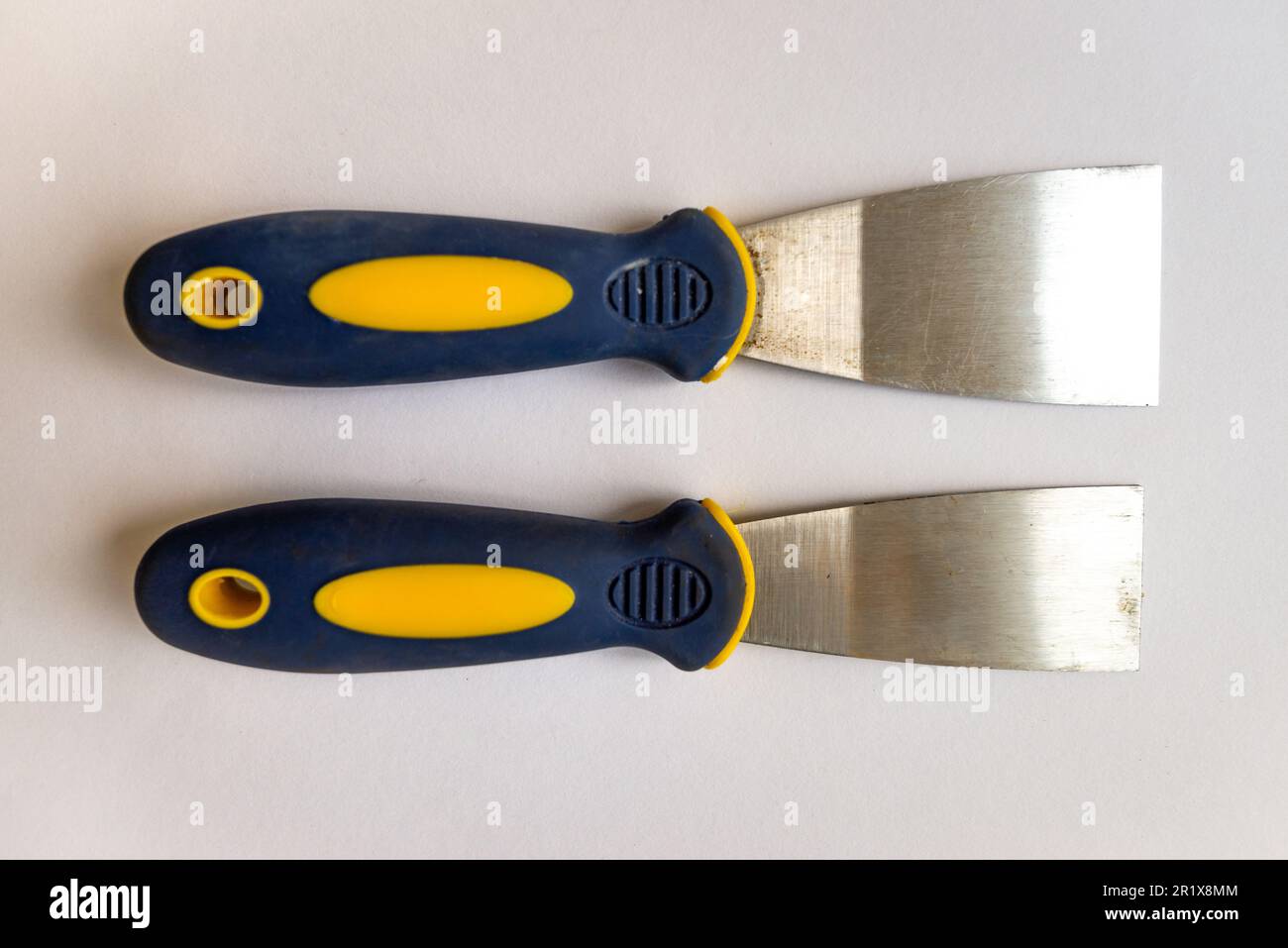 Putty knife, wallpaper and paint scraper hand tool set. Remove paint