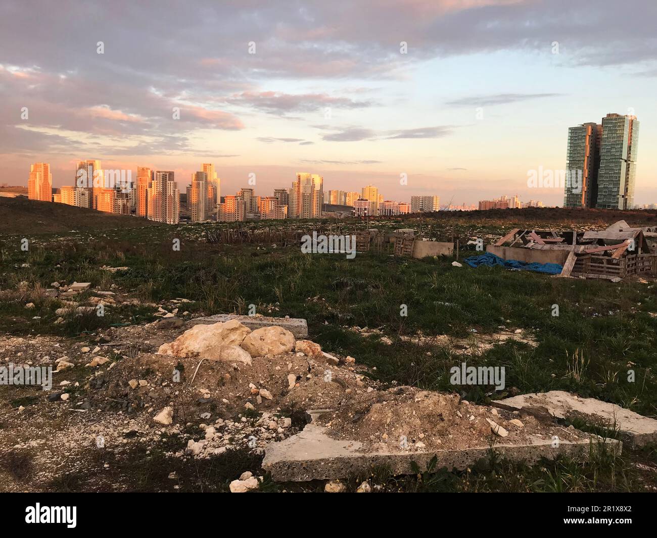 Barren land and modern buildings at sunset in Istanbul, Turkey. Stock Photo