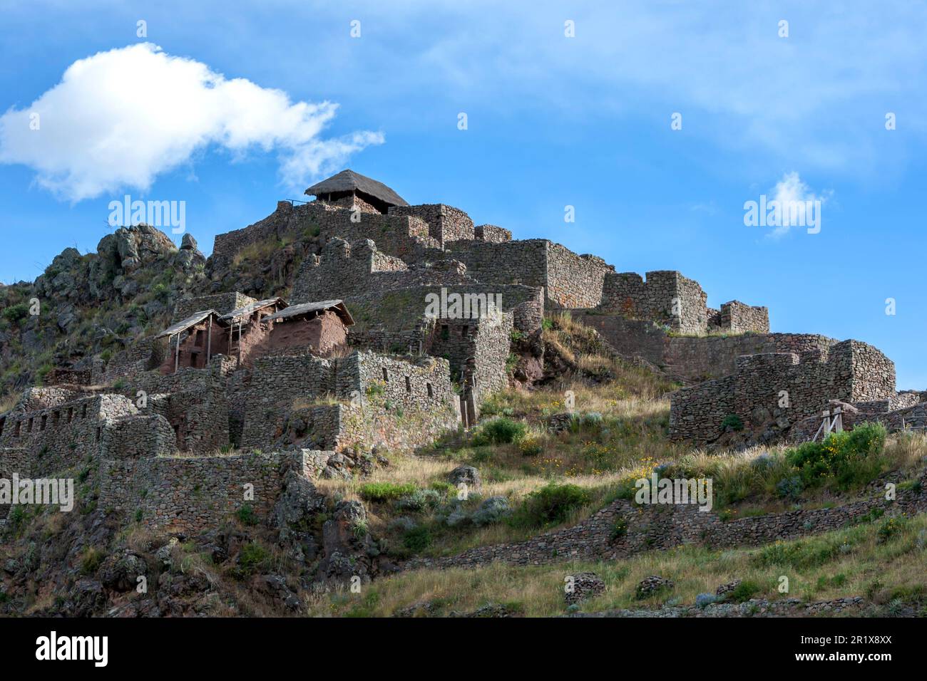 The ancient ruins of Pisac in the Sacred Valley of the Incas in Peru. These Incan ruins, known as Inca Písac, lie atop a steep mountain. Stock Photo