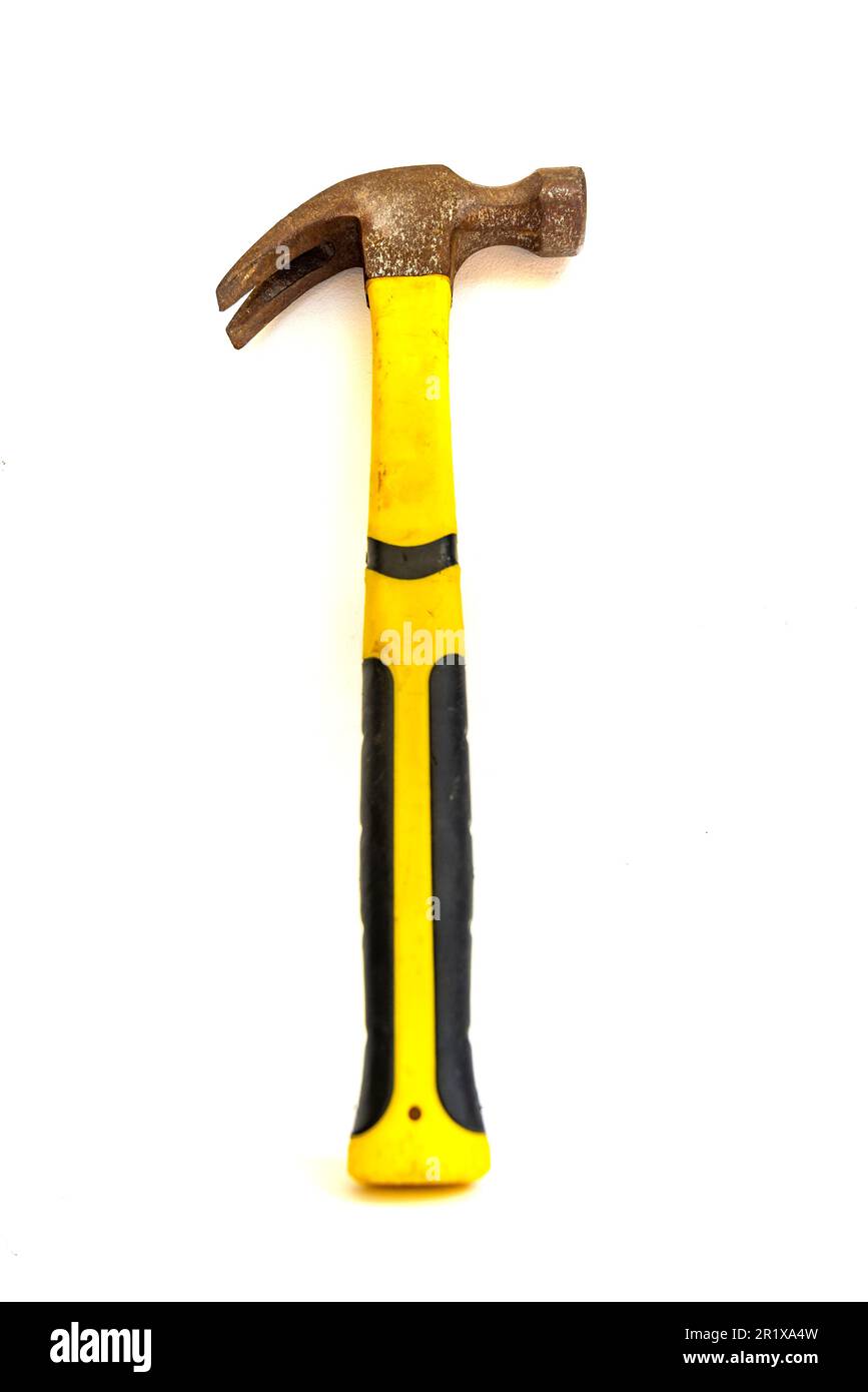 Close up of old, used hammer with yellow and black handle. Isolated on white background.  Stock Photo