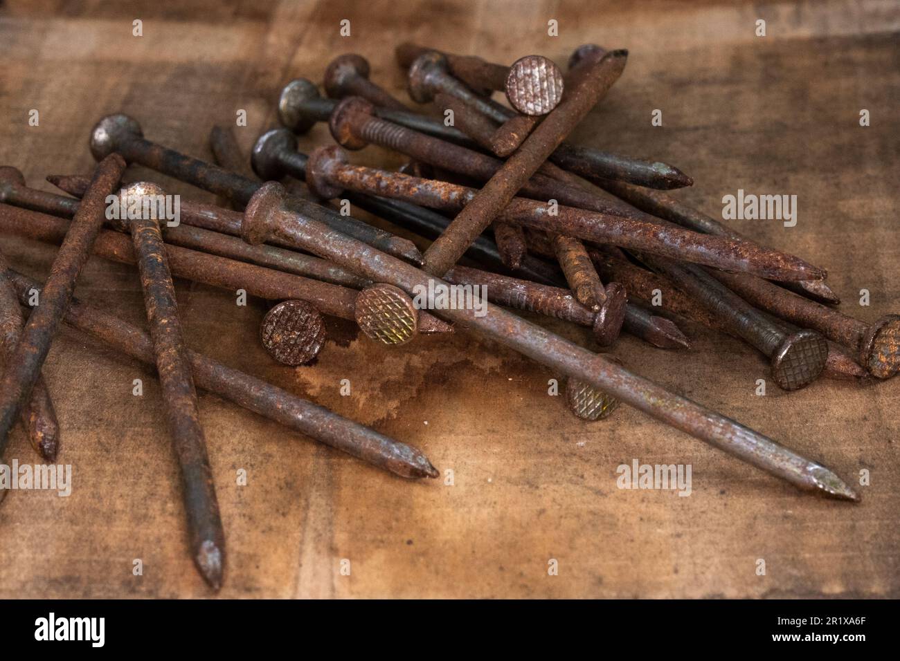 old rusty, 16 penny nails, pile of heavy penny nails for construction