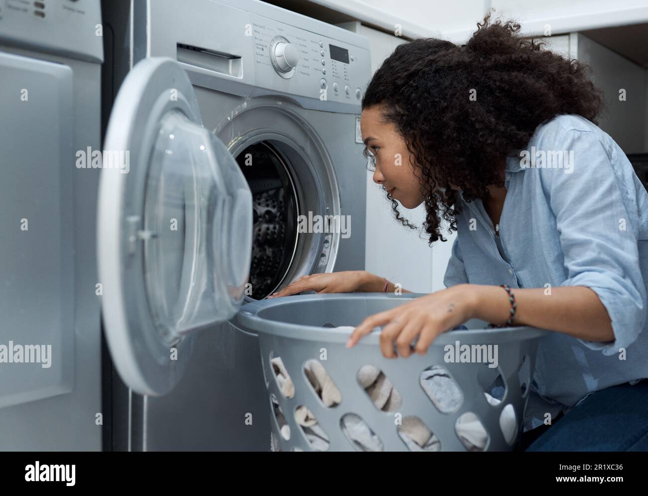 Woman, laundry and washing machine, cleaner with basket and