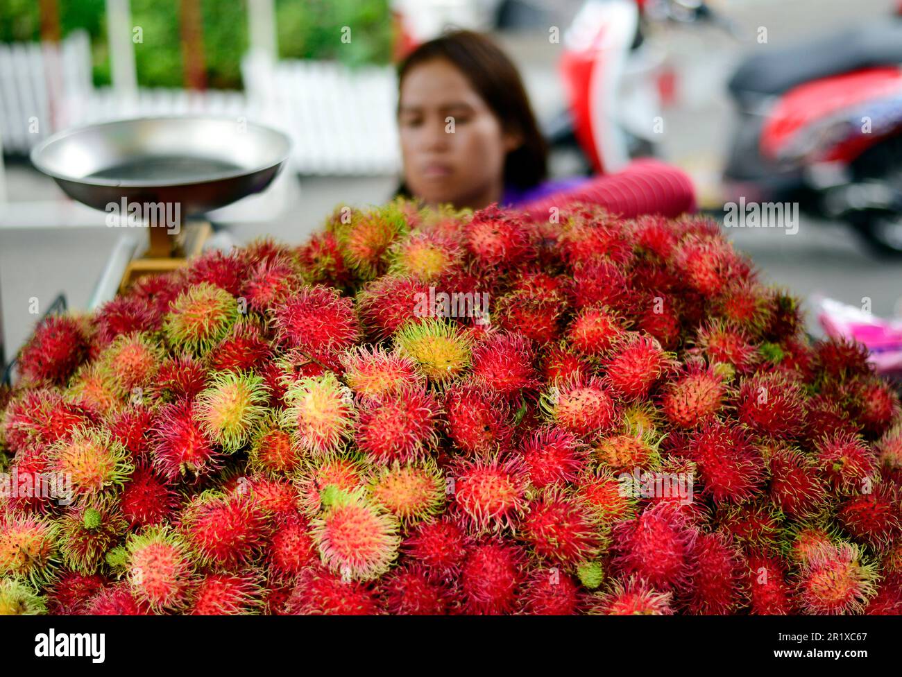 A Rambutan vendor in Bangkok, Thailand. Stock Photo