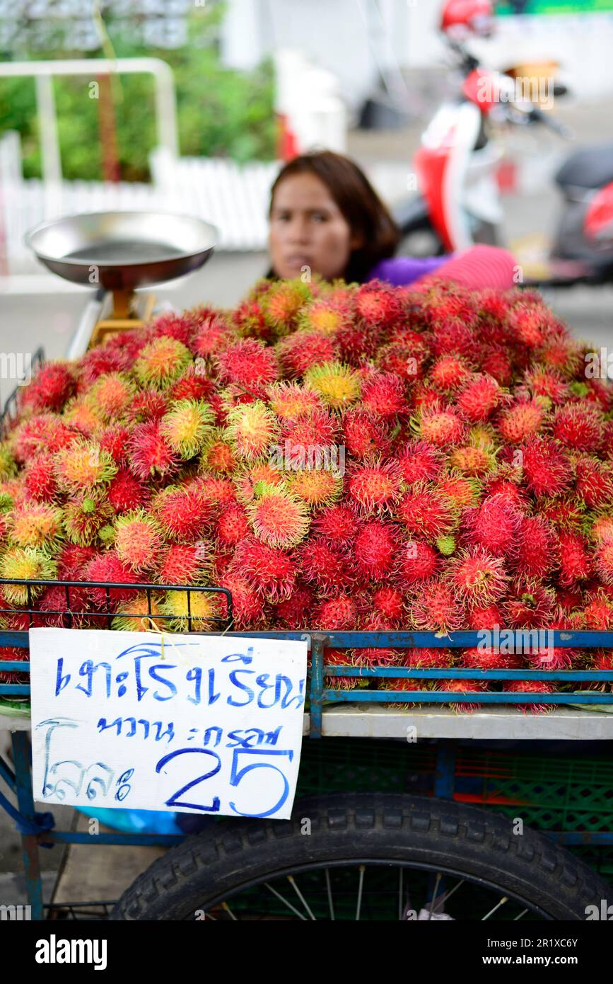 A Rambutan vendor in Bangkok, Thailand. Stock Photo