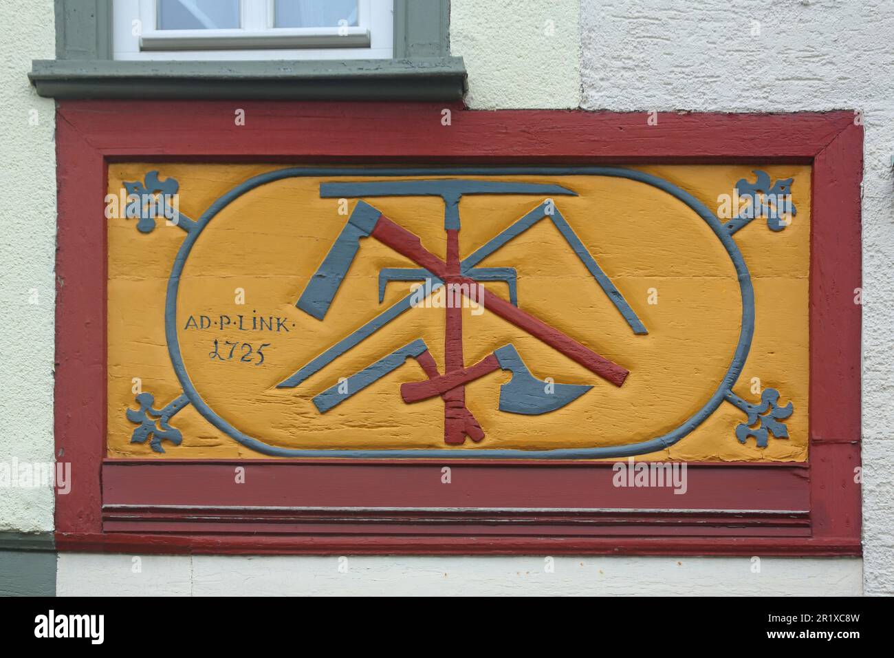 Guild sign of the historic carpenter profession at the half-timbered building, Idstein, Taunus, Hesse, Germany Stock Photo