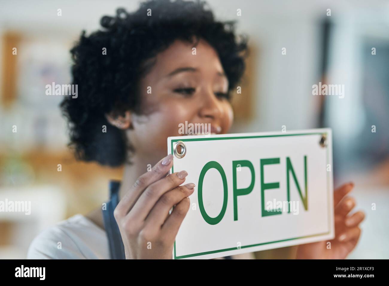 Happy woman, open sign and window at cafe in small business of waitress for morning or ready to serve. Female person or restaurant server holding Stock Photo