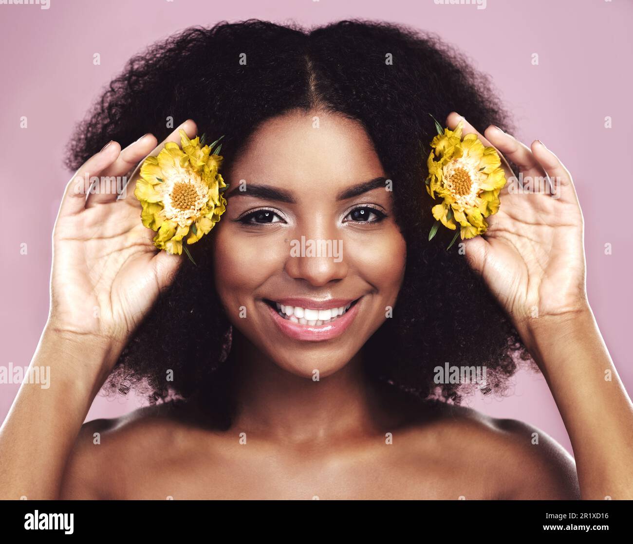 Happy woman, hair and daisy flowers in studio, pink background and