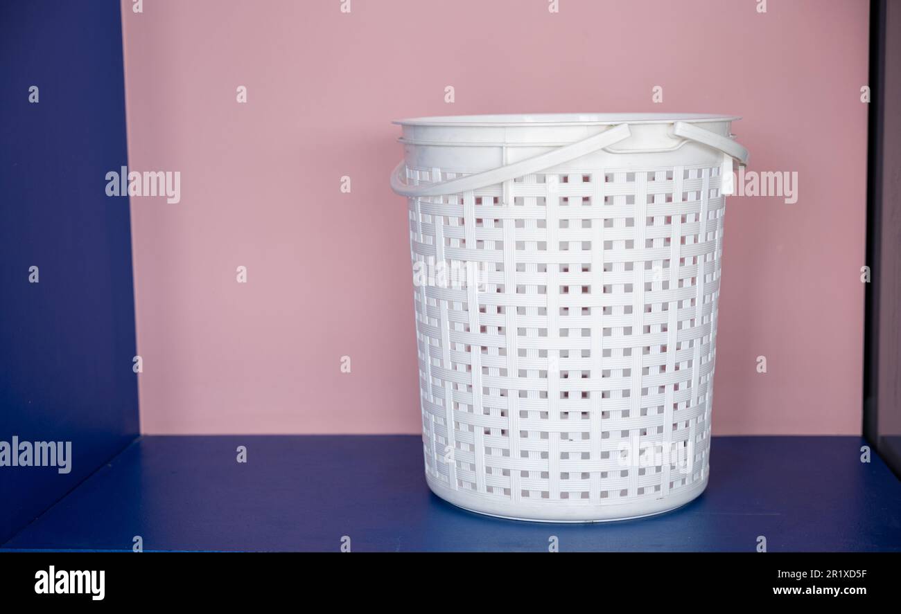 Empty new white plastic laundry clothes basket at convenience store Stock Photo