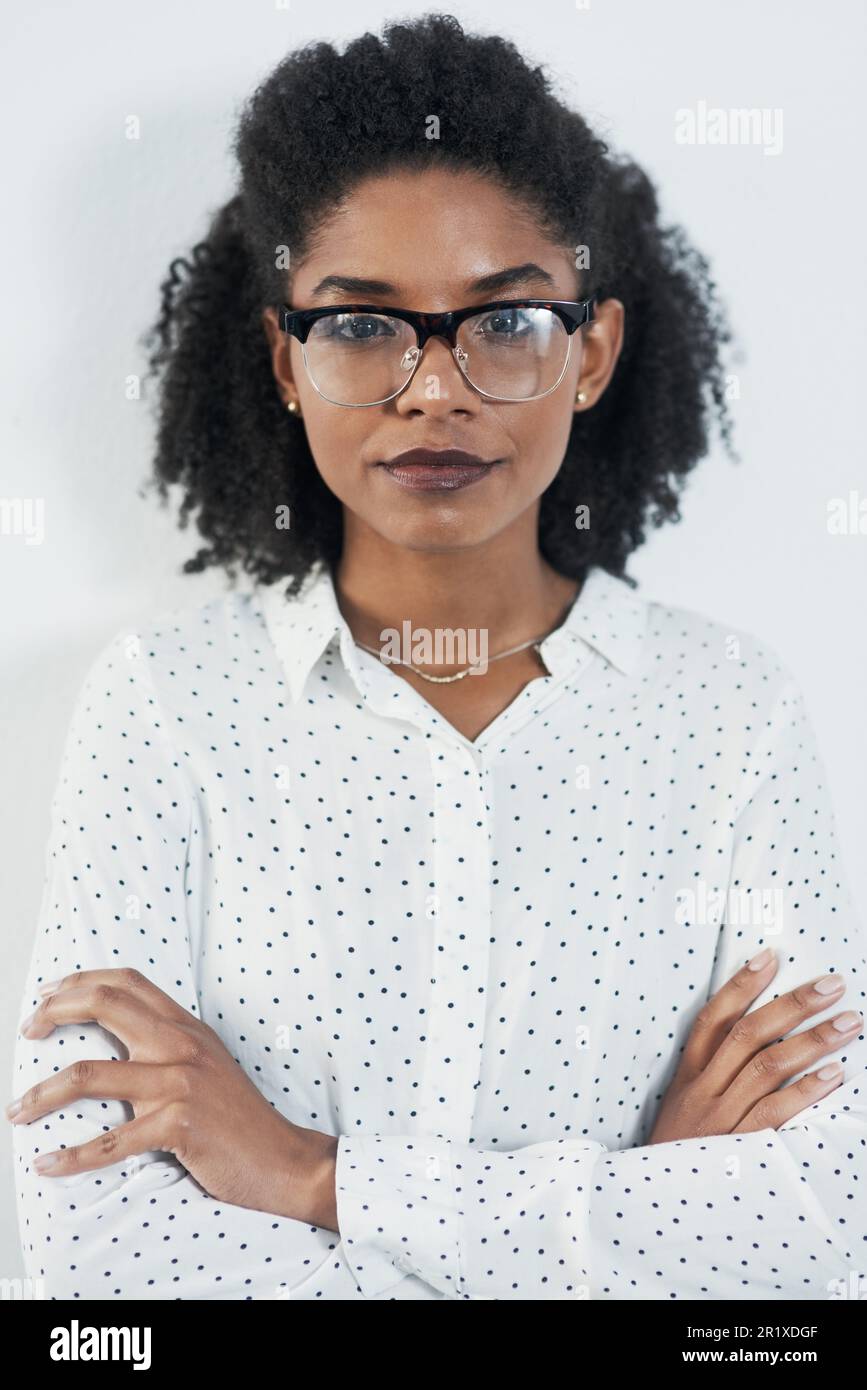 Business portrait, serious and black woman with arms crossed in studio ...