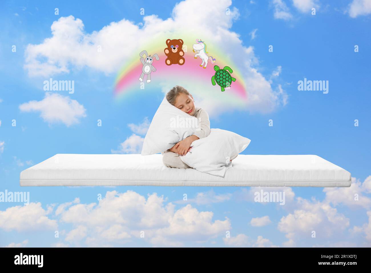 Sweet dreams. Sleepy girl hugging pillow on mattress in blue sky and