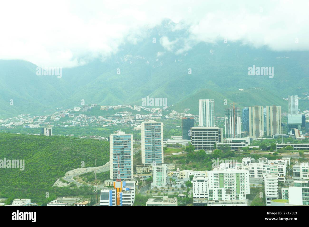 Beautiful view on city with many buildings under thick fog Stock Photo