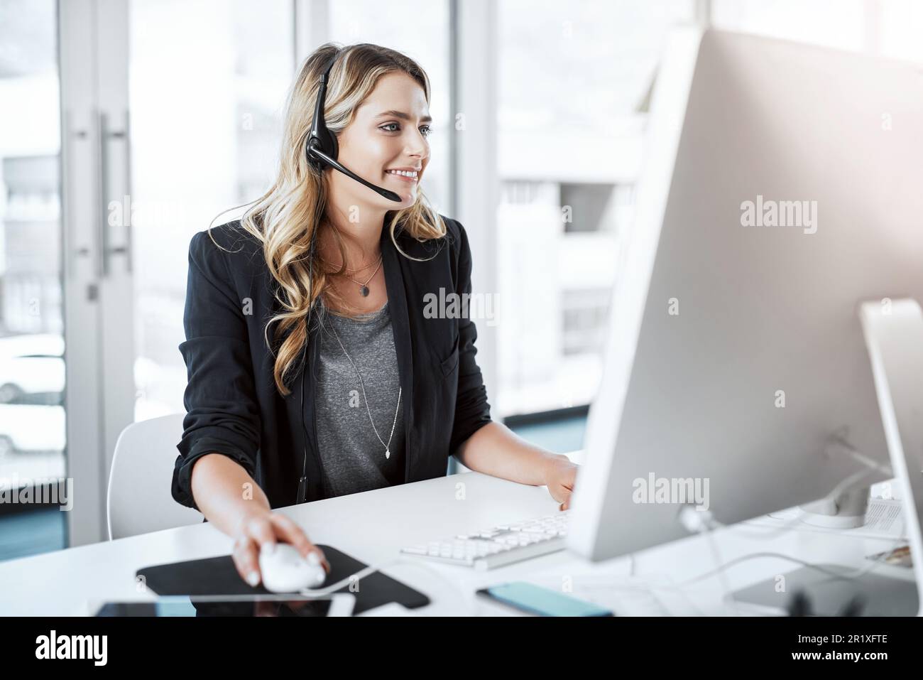 Computer, personal assistant and female receptionist in the office ...