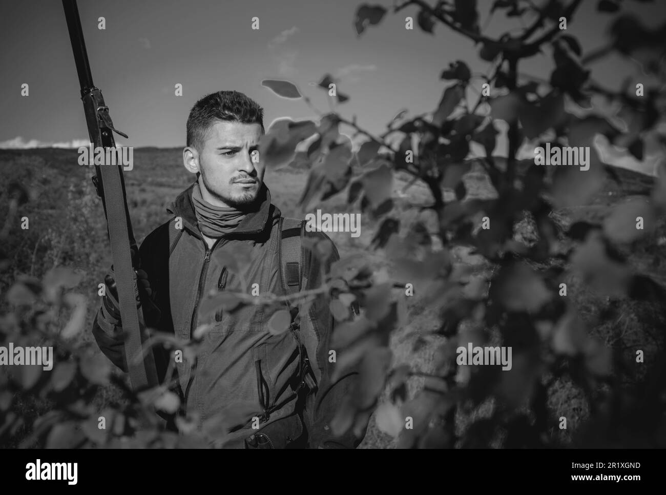 Autumn hunting season. Hunter in camouflage clothes ready to hunt with