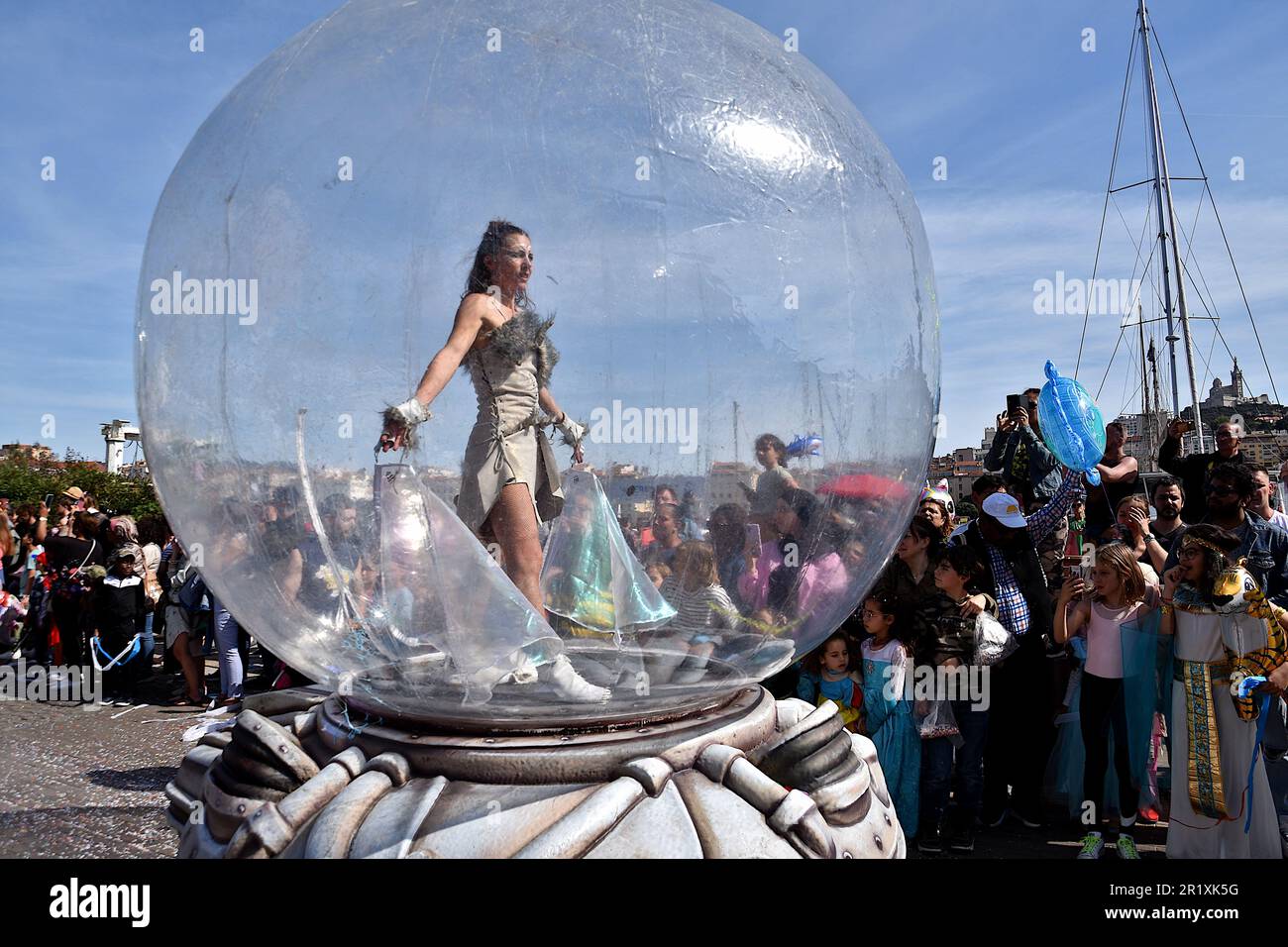 An acrobat performs during the carnival. The parade of The Marseille ...