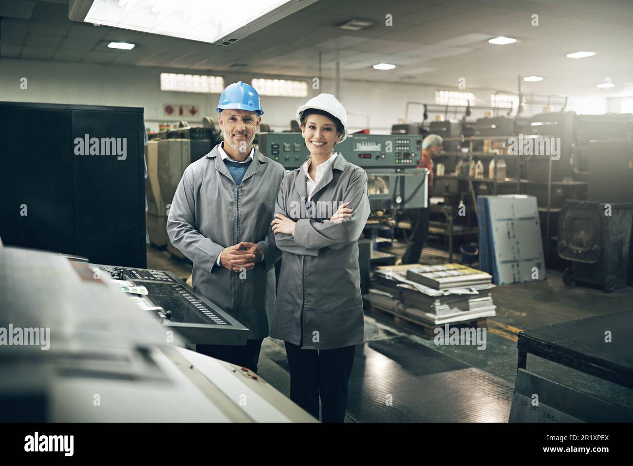 Weve got your printing needs covered. Portrait of two managers standing inside a printing and packaging plant. Stock Photo