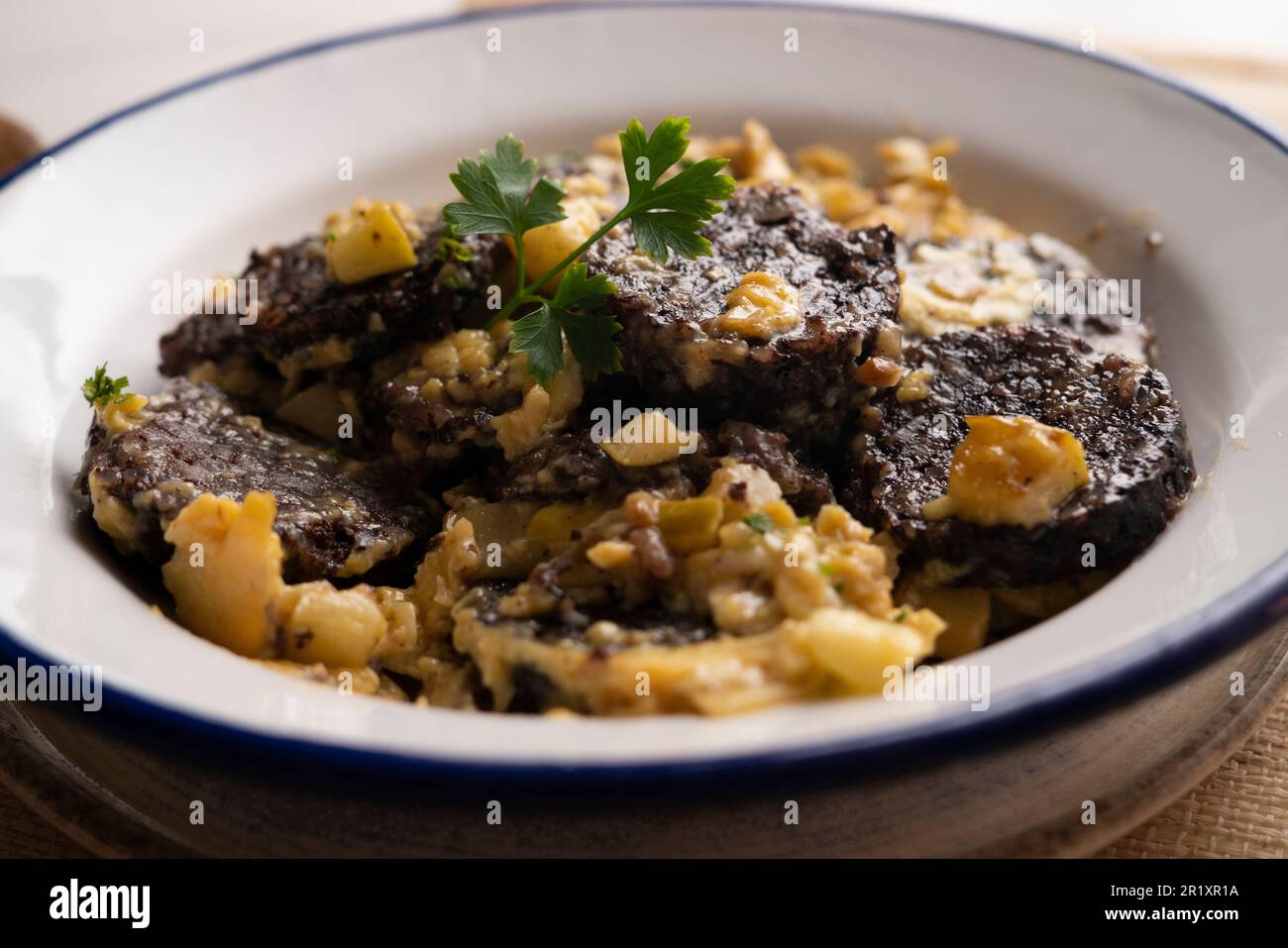 Scrambled with egg, young garlic and black blood sausage. Traditional