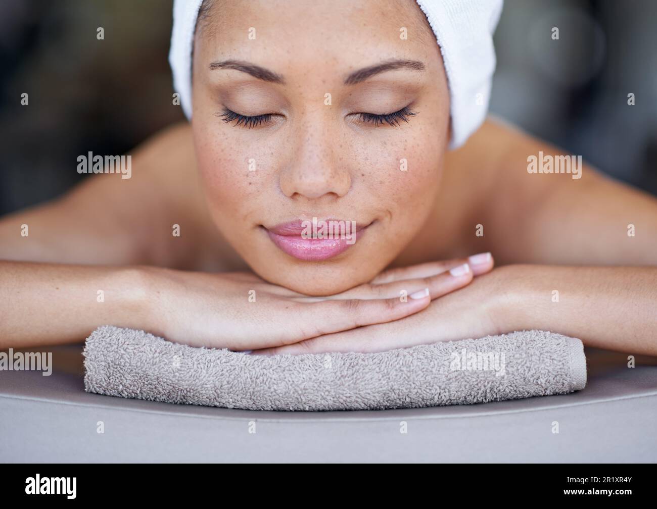 Perfectly relaxed. a young woman lying on a massage table Stock Photo