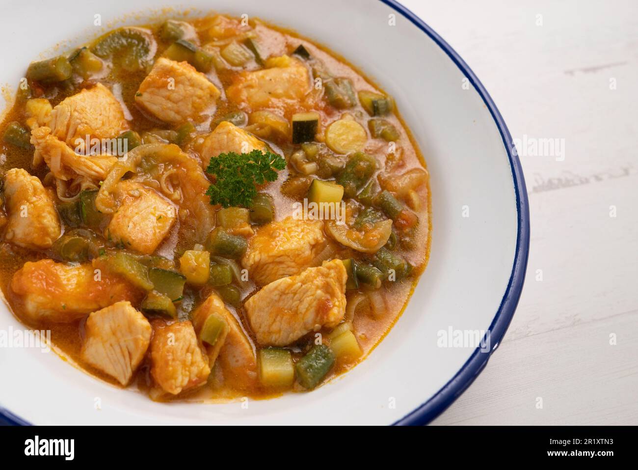 Cubed turkey tenderloin cooked with curry and vegetables. Stock Photo