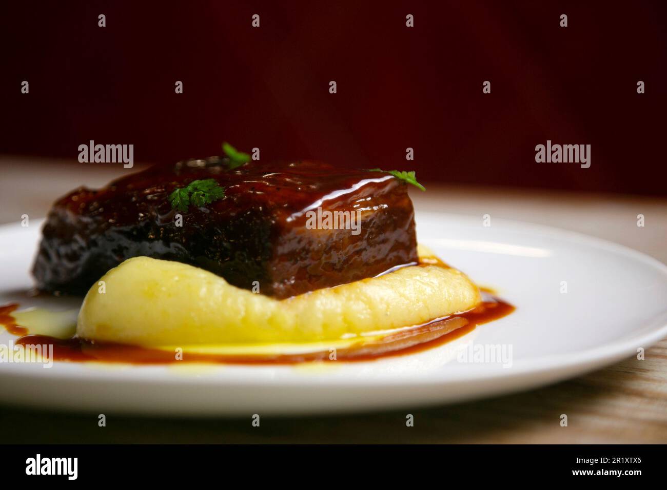 Bacon cooked in the oven at a low temperature in a luxury restaurant