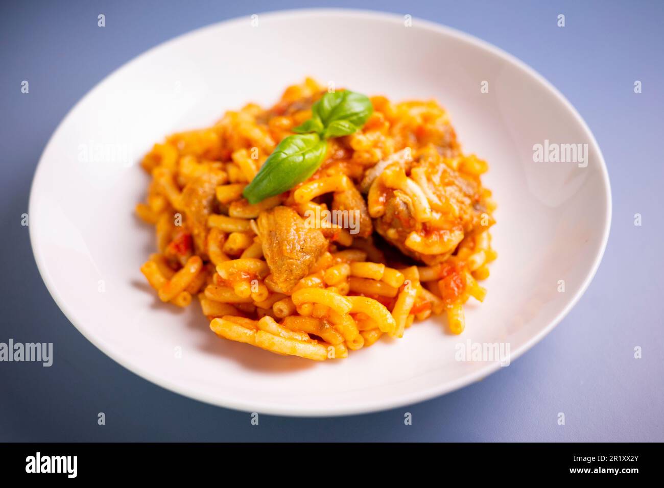 Paella fideua with chicken.Fideuá is a dish originally from Gandía that is  made in a similar way to paella, although based on noodles instead of rice  Stock Photo - Alamy