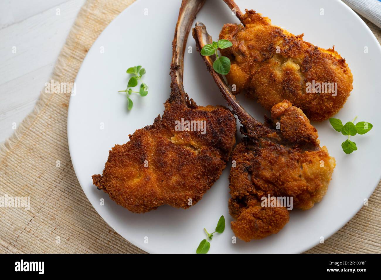 Malcom Reed Lamb Ribs Breaded lamb ribs in a restaurant in spain Stock Photo - Alamy