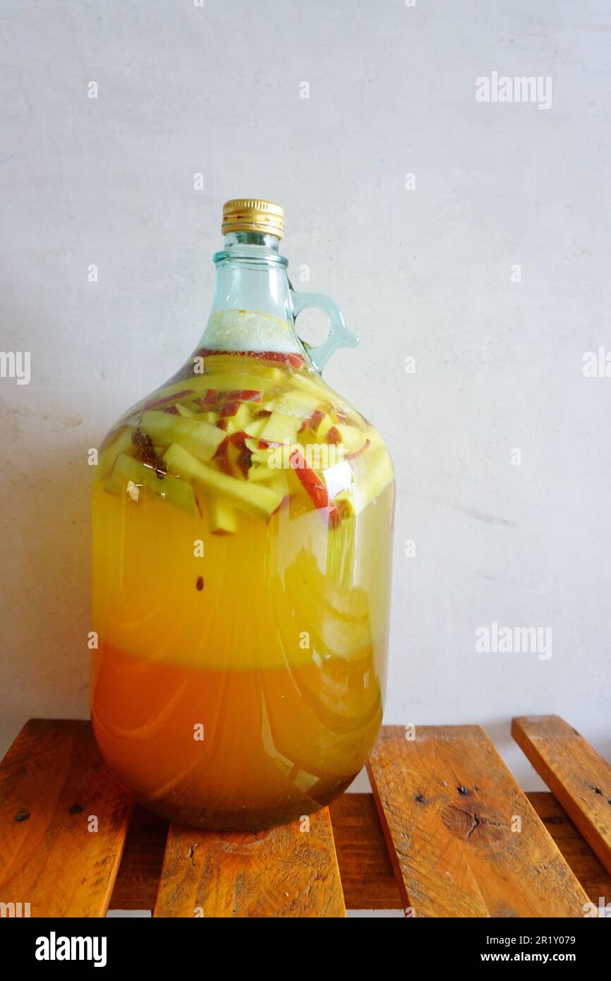 Fermentation of apple mead or fruit wine in a glass carboy Stock Photo
