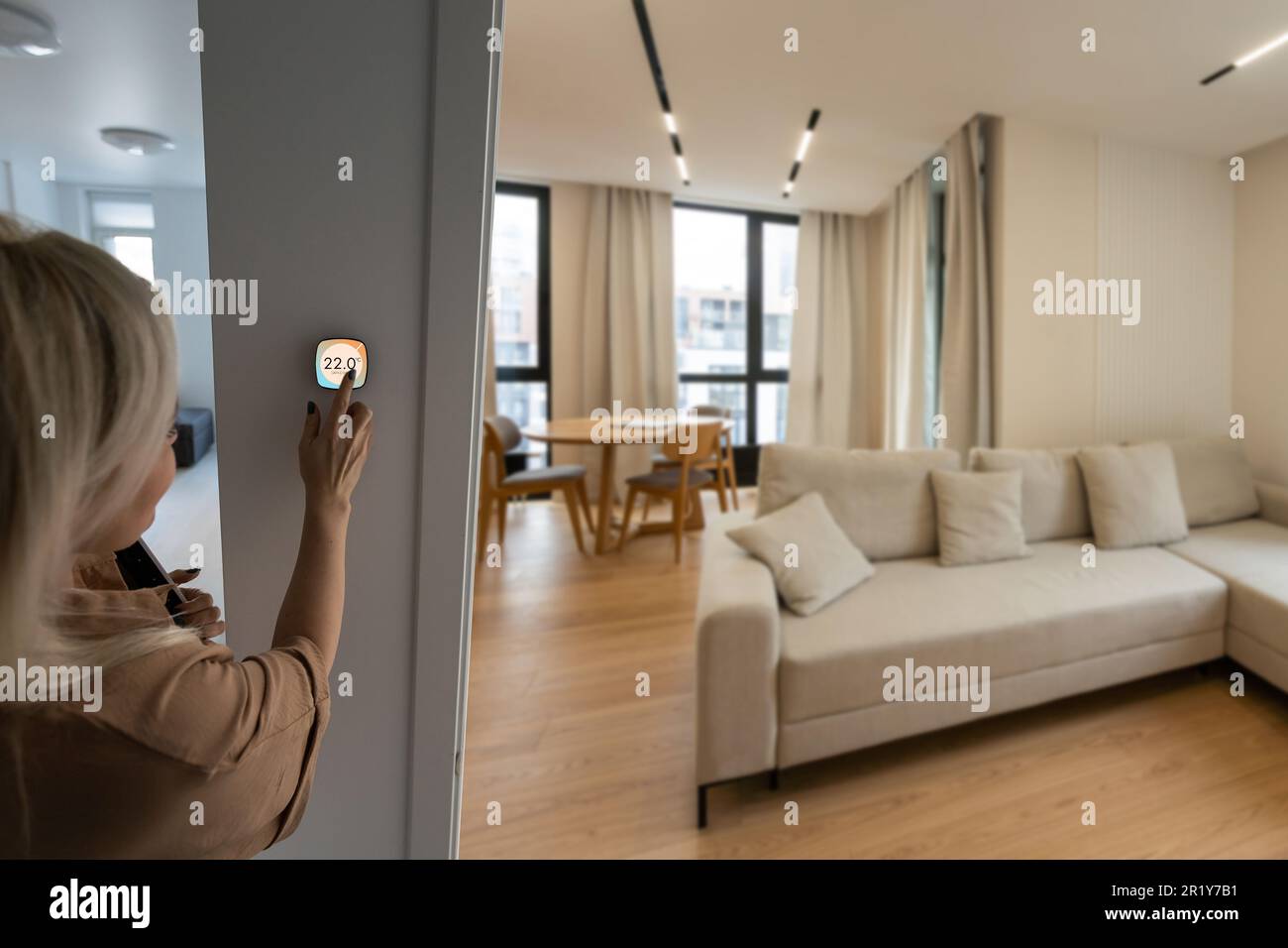 Using Home Phone Woman using smartphone to control home connectivity interface Stock ...