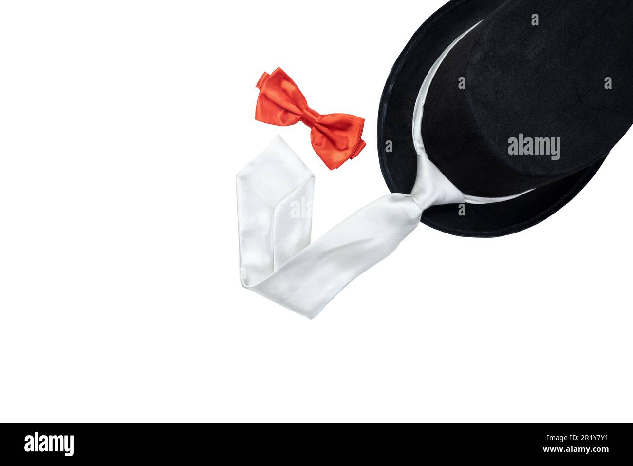 Black hat and silver tie with red bow tie isolated over white ...
