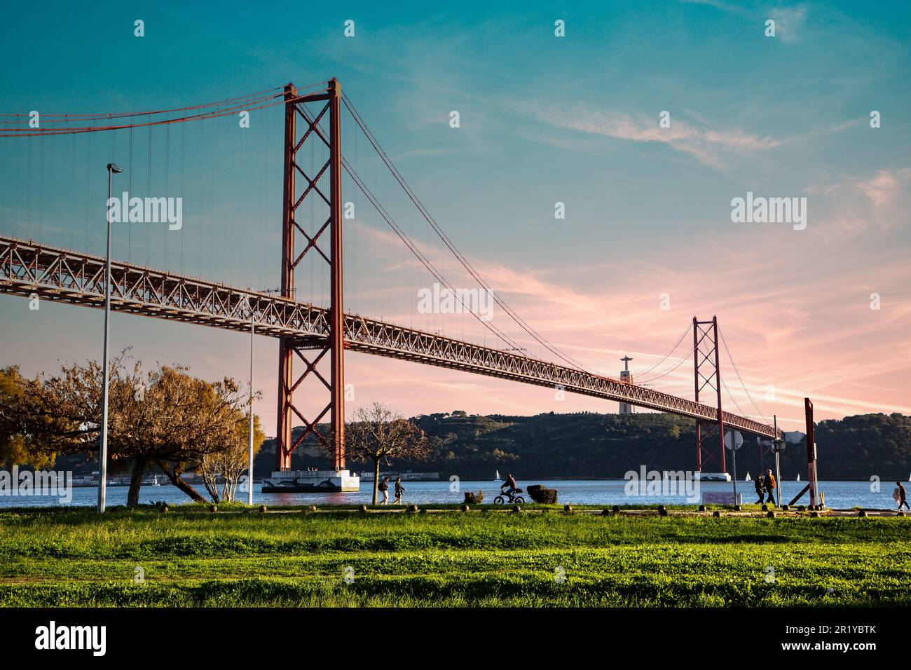 Sunset on the 25th of April bridge in Lisbon Stock Photo