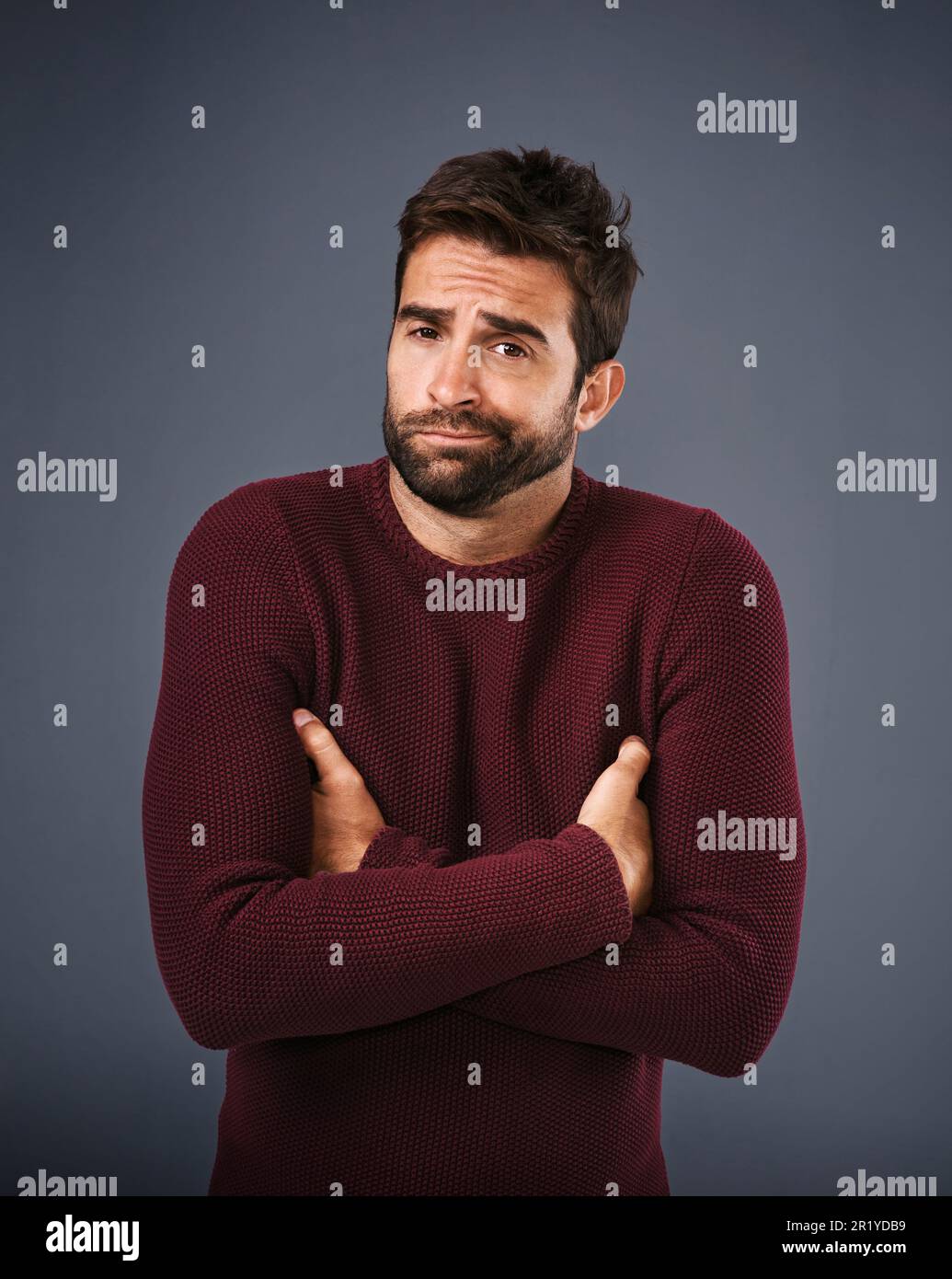 Doubt, shrug and portrait of man in studio unsure against a grey background space. Confused, face and shrugging male with dont know expression Stock Photo