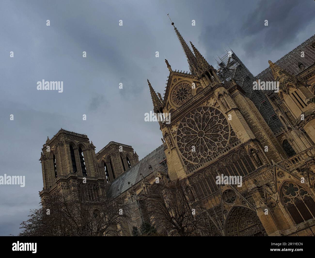 The Notre Dame cathedral in France against a backdrop of cloudy skies ...