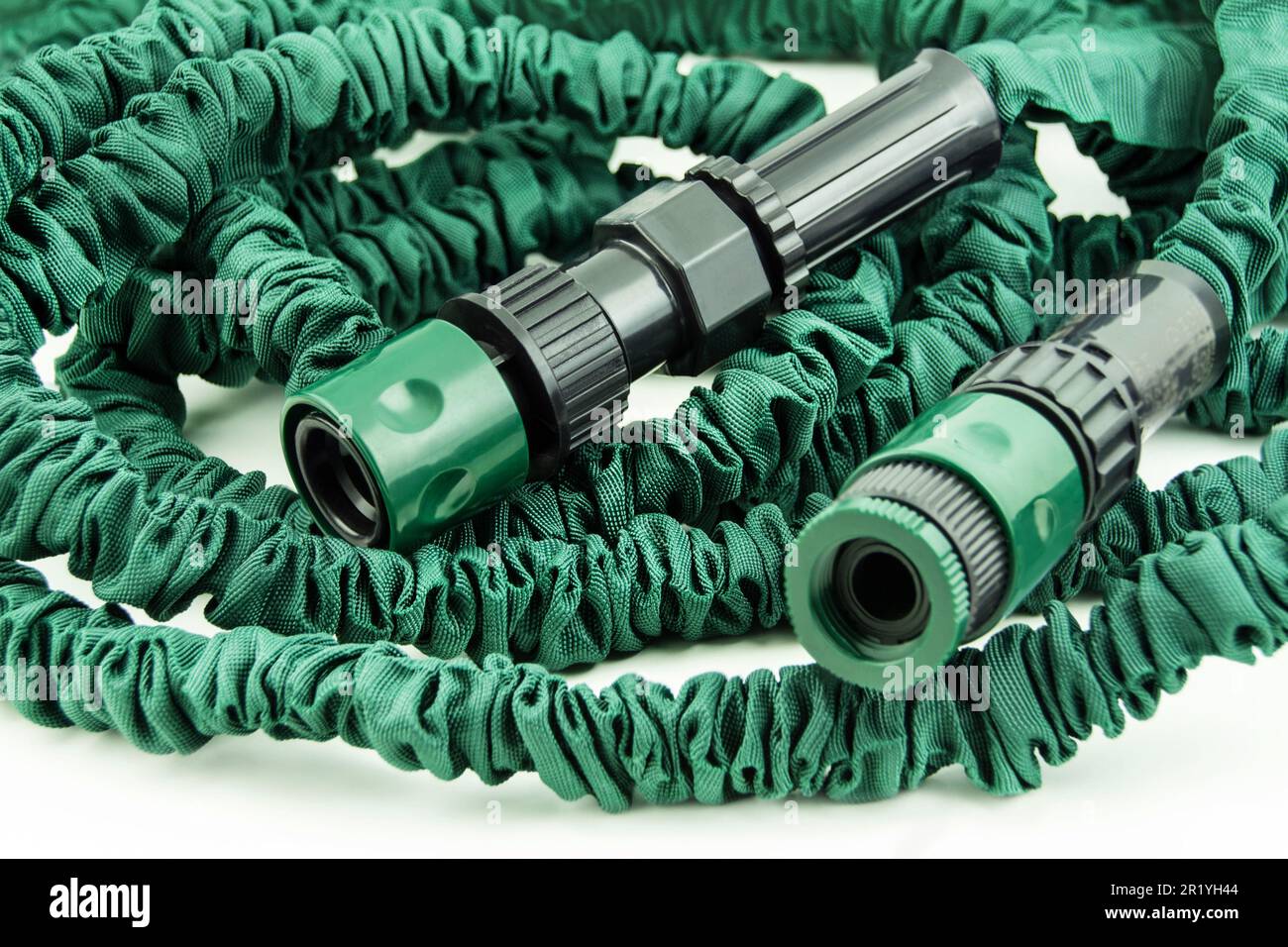 Green flexible garden hose close up Stock Photo