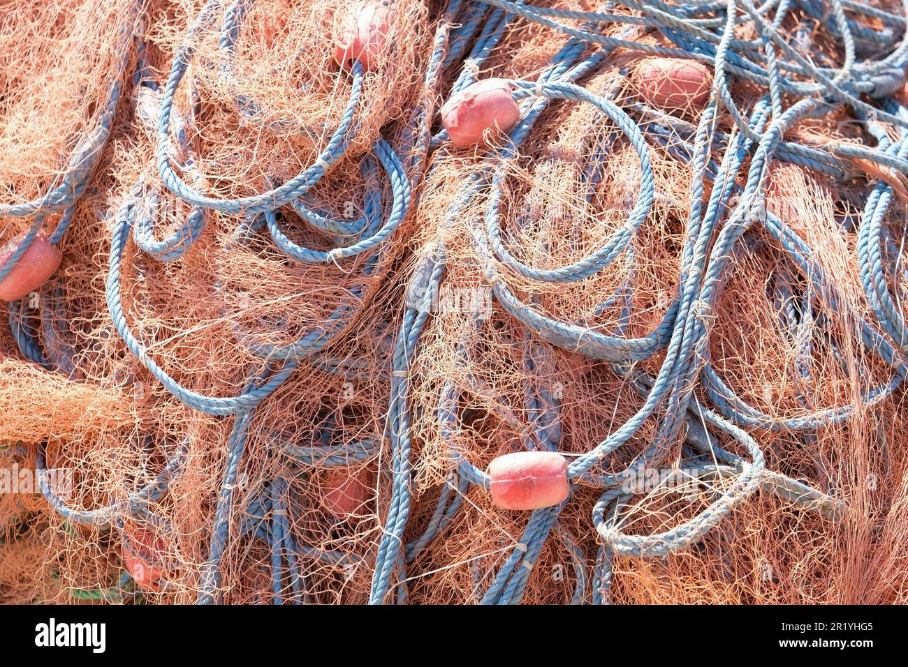 Mixture of colorful fishing nets, floats and ropes. Fisherman material  background Stock Photo - Alamy