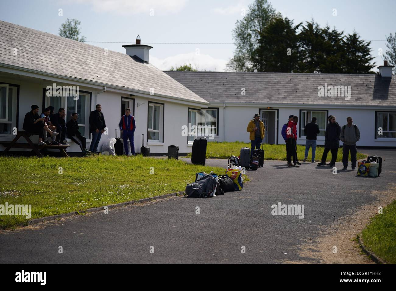 Recently arrived asylum seekers outside holiday homes which form part of the Magowna House hotel