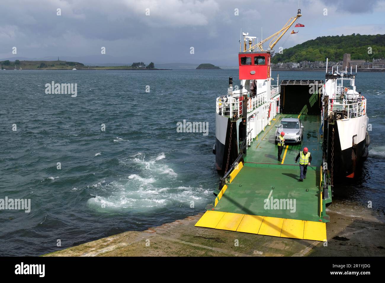 Oban, Scotland, UK. 16th May 2023.  A hive of activity at the Ferry terminal with passengers embarking Calmac ferries to the Hebridean Isles and disembarking back to the mainland. MV Loch Striven operates a service between Oban and Lismore. Disembarking a single car and a single foot passenger in Oban. Credit: Craig Brown/Alamy Live News Stock Photo