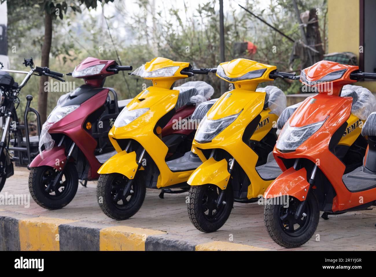 Kerala, India on January 15, 2023 Sale of multicolored Scooters Stock