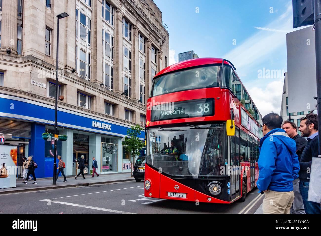 Iconic red, no.38 double decker bus in London, UK Stock Photo