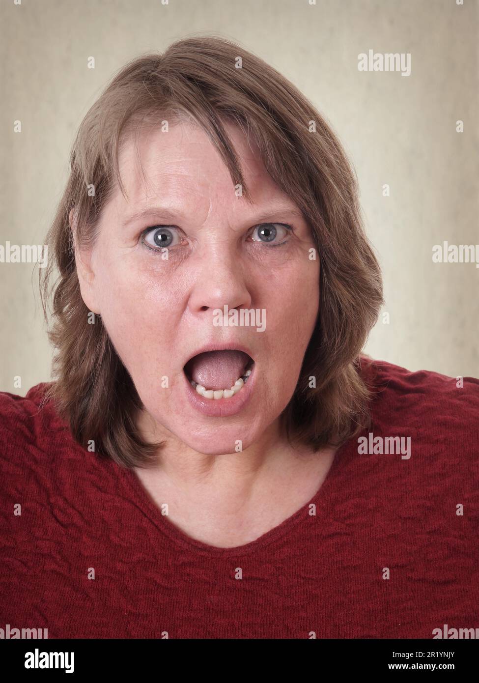mature senior woman shocked with open mouth Stock Photo - Alamy