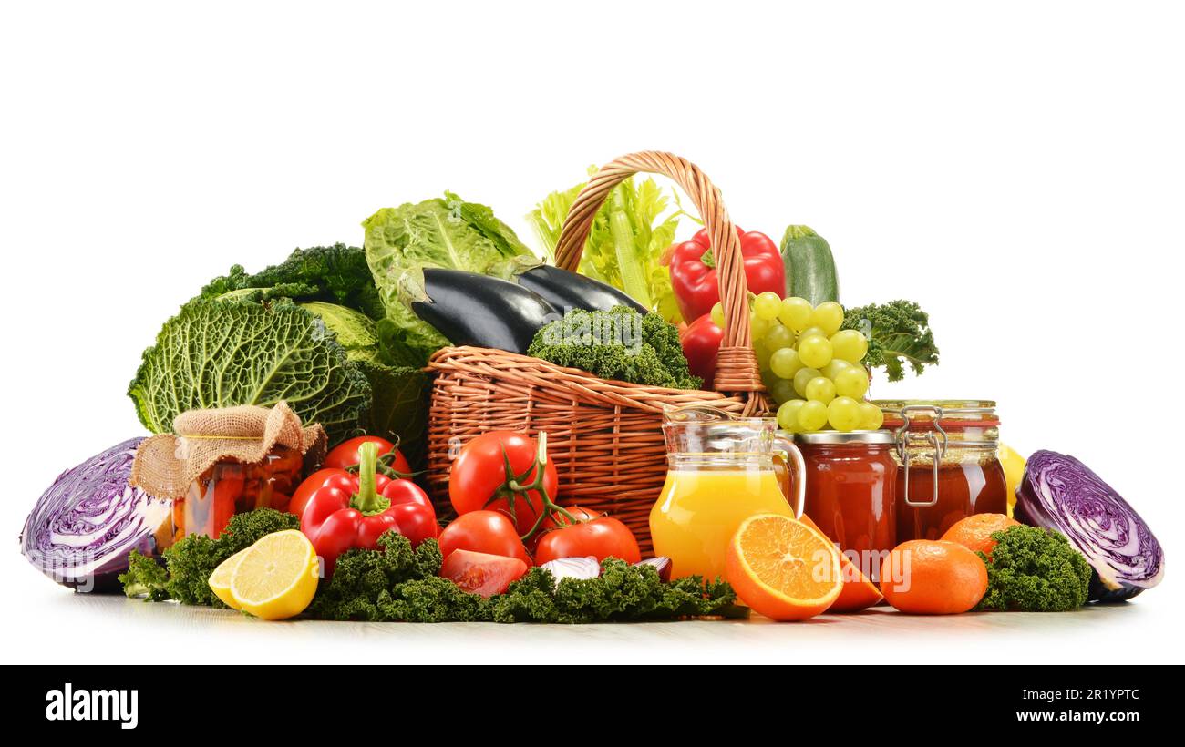 Wicker basket with assorted organic vegetables and fruits isolated on ...